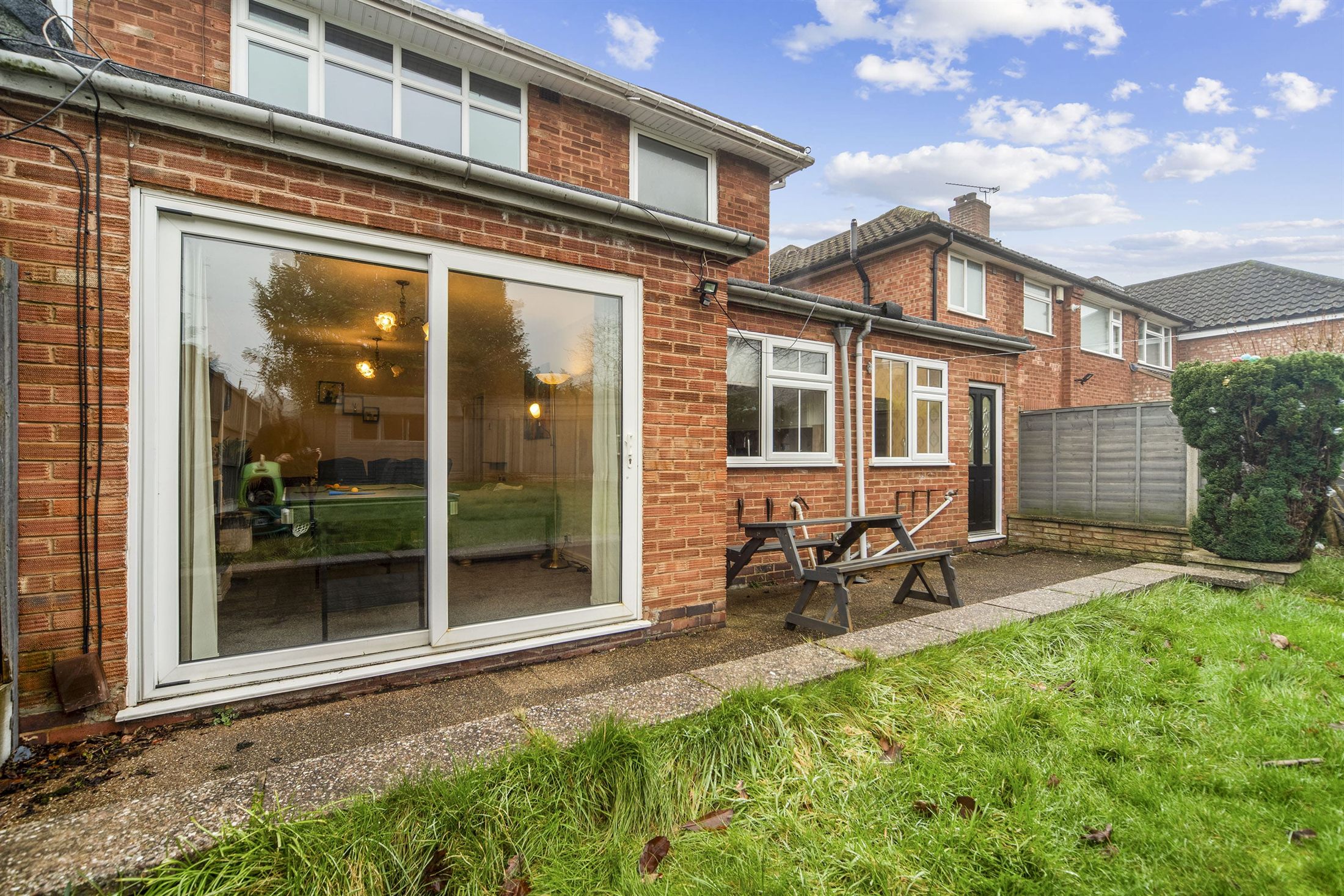 The rear garden and patio of the Rowlands Crescent house in Solihull